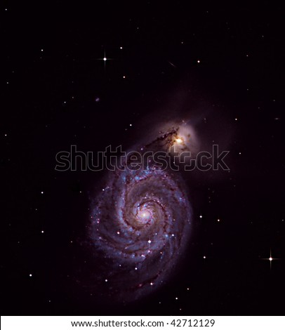 The Whirlpool Galaxy, Messier Object 51, colliding with another Galaxy