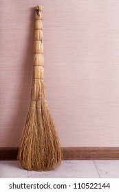 Whisk Broom Standing In Empty Room