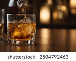 Whiskey being poured into a glass with ice cubes in a dimly lit bar. The amber hues of the whiskey and the soft, warm lighting create a cozy, inviting atmosphere, perfect for themes of relaxation.