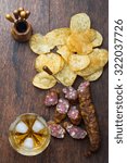 Whiskey Bourbon in a Glass with hand-cooked crisps and dry sausage