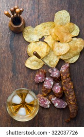 Whiskey Bourbon in a Glass with hand-cooked crisps and dry sausage