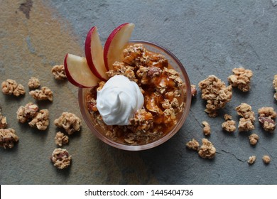 Whiskey Caramel Apple Crisp Topped With Homemade Whipped Cream And Whiskey Soaked Apple Slices