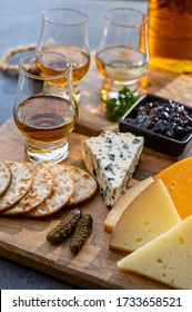 Whiskey And Cheese Pairing, Tasting Whisky Glasses And Plate With Sliced Cheeses Close Up