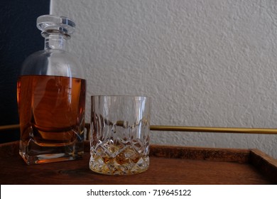 Whiskey Decanter And Glass On Bar Cart