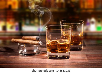 Whiskey Drinks With Smoking Cigars