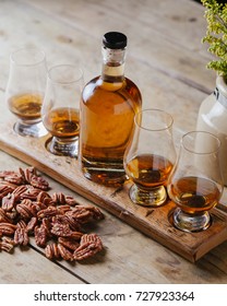 Whiskey Flight On Rustic Wooden Surface