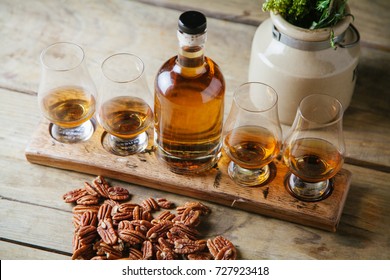 Whiskey Flight On Rustic Wooden Surface