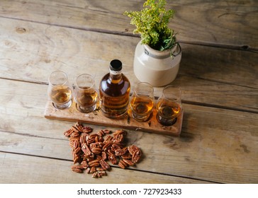 Whiskey Flight On Rustic Wooden Surface