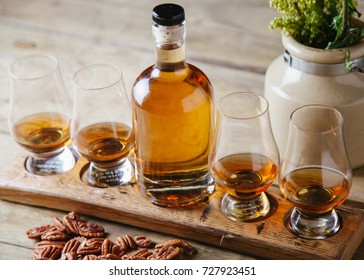 Whiskey Flight On Rustic Wooden Surface