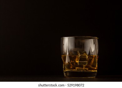 Whiskey Glass On Dark Background