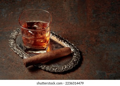 Whiskey with ice and cigar on a rusty metal table. - Powered by Shutterstock