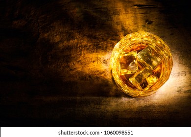 Whiskey With Ice Cubes On Wooden Background