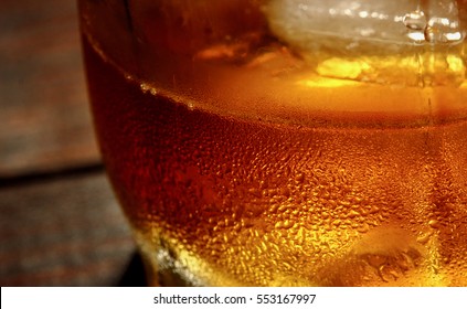 Whiskey And Ice Macro Background.Food And Drinks Macro Texture Concept