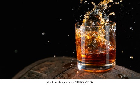 Whiskey Liquid Falling Into Glass, Freeze Motion.