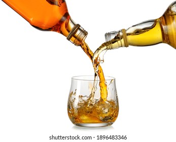 Whiskey Pouring On A Glass From Two Bottles, Blending Whiskey Concept