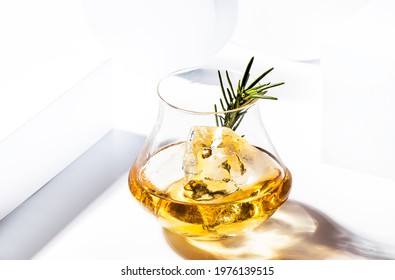 Whiskey, Scotch Or Bourbon Glass With Rosemary, Shard Ice On Black White Background With Geometric Cubes And Circles. Contemporary Still Life 