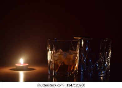 Whiskey and tea light candle - Powered by Shutterstock