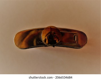 A Whisky Flask Seen From Above, And The Photographer Reflected On It