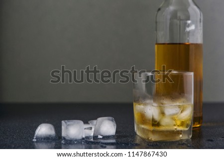 Whisky and glass drop ice cubes, alcohol wallpaper.