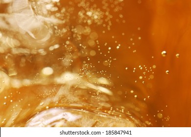 Whisky And Ice In Glass, Bubble Float, Background.