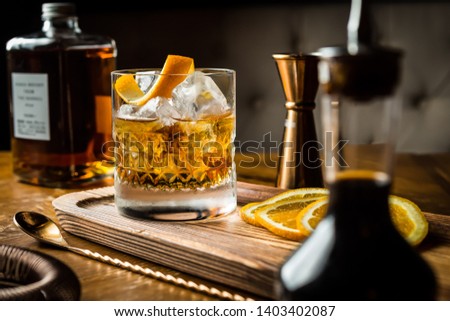 Whisky Old Fashioned served on the rocks with orange