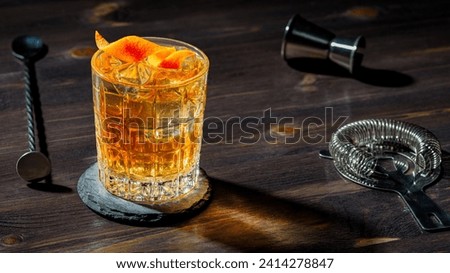 Whisky Old Fashioned served on the rocks with orange