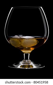 Whisky On The Rocks Over Black In A Beautiful Glass