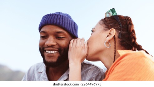 Whisper, communication and friends in a gossip conversation about secret, rumor or interesting couple news. Rooftop discussion, talking in ear and gen z woman share information to listening black man - Powered by Shutterstock