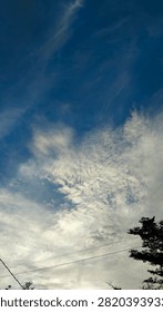 Whispering Winds and Dramatic Clouds in the Blue Sky