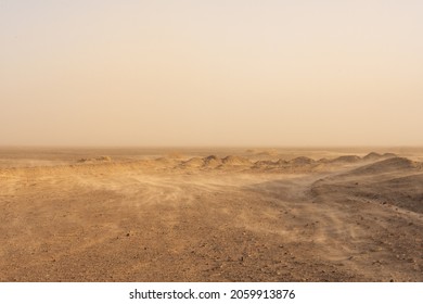 Whisps Of Sand Blow Over The Barren Desert Floor - Shutterstock ID 2059913876