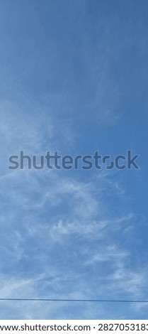 Whispy Clouds in a clear blue sky