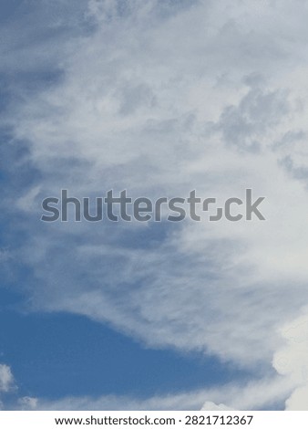 Whispy clouds summer daylight blue sky