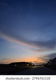 Whispy rainbow cloud at sunset