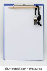 Whistle and planning board on white background, sport strategy, tactic concept