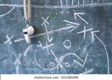 Whistle Of A Soccer Or Football Referee / Coach On Black Board With Tactical Diagram