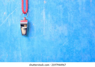 Whistle Of Soccer Referee Or Trainer  On Blue Grungy Background. Great Soccer Event This Year, Large Free Copy Space, Soocer Or Football Template