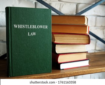 Whistleblower Law And A Stack Of Book On A Shelf.