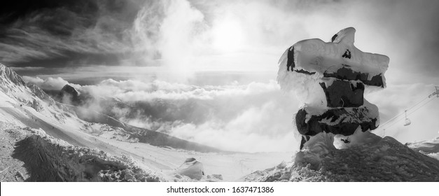 Whistler, British Columbia, Canada. Beautiful Panoramic View Of Top Of Mountain With The Canadian Snow Covered Landscape In Background During A Cloudy And Winter Sunset. Black And White Art