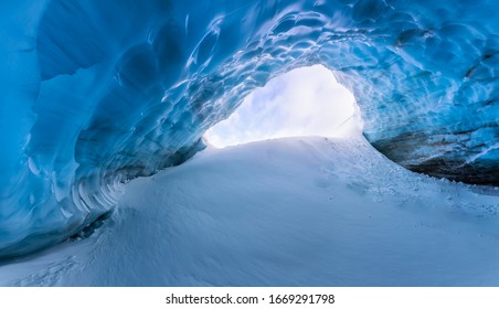 Whistler, British Columbia, Canada. Beautiful View of the Ice Cave in the Alpines on top of Blackcomb Mountain with people visiting. - Powered by Shutterstock