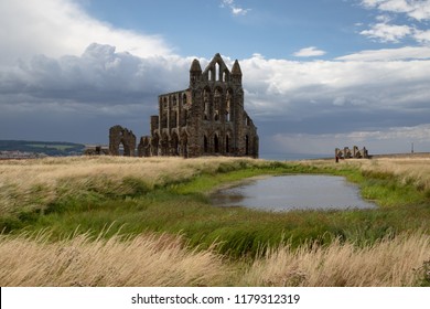 Whitby, UK - July 28, 2018: Ruins of Whitby Abbey, a 7th-century Christian monastery.  Inspiration for Bram Stoker's tale Dracula. Whitby is a popular seaside resort in the UK.