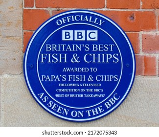 Whitby, UK - June 10th 2022: An Award Plaque On The Exterior Of A Fish And Chip Shop In Whitby, North Yorkshire - The Shop Was Voted As The Best Fish And Chip Shop In Britain.