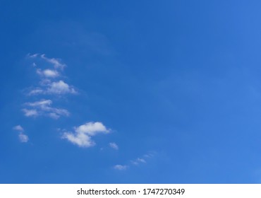 Whitchurch, Shropshire/UK – 6 1 2020:  This Background Image, Illustrating ‘blue Sky Thinking’, Shows A Clear Blue Summer Sky With Only A Few Wispy Clouds To Clutter To A Thinker’s Vision.