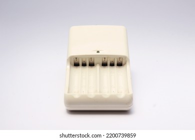 White AA Battery Charger With Capacity To Charge Four Batteries.