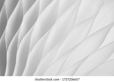 White abstract background with bizarre pattern. Soft lines transition light and dark shadows. Photos with soft focus.
