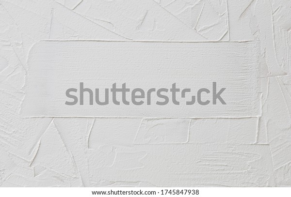 white abstract background of\
putty or gypsum with irregular dashes and strokes and place for\
text