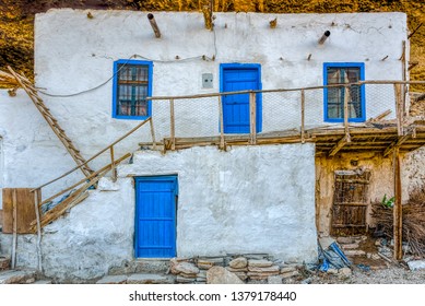 White Adobe House With Wooden Stairs In A Village, Ermenek, Anatolia, Turkey