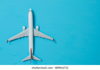 White Airplane On A Blue Background, Top View