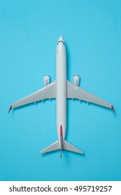 White Airplane On A Blue Background, Top View