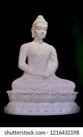 White Alabaster Statue Of Buddha Sitting In The Lotus Postion. 