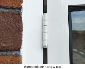 The White An Almunium Frame Window Hinge On A Red Brick Wall House 